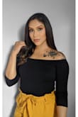 This bodysuit is so cute, I also have it in white they go with everything and the off-shoulder adds the right amount of skin. Everyone needs this! - Monique P.