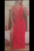 Ordered a size small which is my typical size in flowy dresses and it fit great! I love the red color as well, very vibrant. There is a shorter lining underneath so it's not see through and its still lightweight for summer. The elastic around the waist is snug but not uncomfortable. I was worried about the non-adjustable strings in the back being too loose but they are pretty good, they could be a teeny bit tighter but it doesn't make the fit look bad. I'd recommend this dress! - Jennelle L.