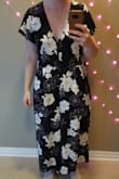 According to the size guide I should order a large for all lulus items but this is too big! It fits my shoulders but the waist is huge and hits too low. And the crotch is like 4 inches below where my crotch is! I'm going to take it to the tailor to see if I can fix this and make it wearable. Looks okay tied up, but there is so much extra fabric in the back and there's lots of gaping where the buttons are. Also didn't realize it would have weird shorts inside it??? Maybe it's the low crotch but I think the short make walking feel weird. - Rachel S.