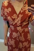 Going to have to get this tailored to fit me too. Sizing guide said that I should be a large (I'm normally a medium but I'm ordering online and so I got with what it told me to get...) I thought it would be OK because it is a wrap dress but when I tie it as tight as I need to it has too much bunching of fabric in the front. It is also extremely long? I have to get it hemmed because the only way I wouldn't trip is if I were wearing 4 inch heels. - Rachel S.