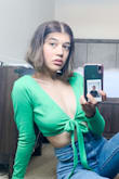 The fit of the shirt was perfect. I wore it with high waisted jeans. I absolutely love this shirt. Plus, green is my favorite color. - Ruby P.