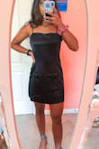 This dress is SO cute, SO versatile, and SO comfy!! The straps are adjustable, which is great! There's also a zipper that goes down the whole back, making it super easy to take on and off. It was a little loose around the bust for me, but with a padded strapless bra, it ended up being perfect. Such a sexy, comfortable material!!! It just needs to be ironed or steamed before you wear it out. - Meena S.