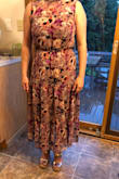 I was wary of this dress at first because I'm only 5'1", which usually means maxis are out of the question (unless I go through the hassle of getting it altered), and a midi is hit or miss. This midi takes the cake! The length is good because you can still see my shoes and doesn't hit at an awkward part of my calf. All the other reviews are right in that it runs large, so you can probably size down (if your bust and waist allow for it). I am almost ALWAYS a size small but got an XS and it fits perfectly. Can't wait to wear this for a date night or a wedding this Summer! - Alex W.