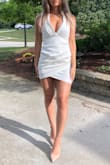The dress is made of thick, quality fabric and the white dress is not see through at all. It was not too tight and fit perfectly in all the right places! Great for formal events - Kaylee W.