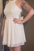 I will be wearing this as a bridesmaid. Very cute and perfect length. Need to wear a bra due to size of the top. - Keely F.