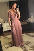 I wasn't super impressed with the material but I do love the color and the idea of the dress. The fit was good except for I kept busting out of the top the little button wouldn't stay closed. length was great. - Chelsea F.