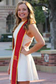 I got this dress for a graduation dress, and I'm thrilled I did! I got so many compliments and felt gorgeous. I typically wear a size 4, and the small was a bit tight but looked great. The back is especially beautiful! - Robina G.