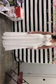 Wore to my bridal shower and so many compliments. Planning to wear it to the beach soon. It hit the floor with plenty extra material and I wore flats. If you are shorter than me then it'll need to be hemmed. I added a belt to wear to a rehearsal. I probs could have went down a size to make it tighter but I felt comfortable. I'm usually a medium to a large. - Allison P.