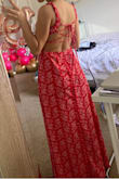 It is a very beautiful dress. It gives me vacation vibes. It's perfect for summer. The dress looks exactly the same in person. The quality is great as always, it isn't thin. For a 5'2" girl the dress goes down to my ankles but it doesn't touch the floor so it's fine. - Esli M.