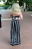 Love this. The pants were super long on me and I had to have them hemmed, but that's normal since I'm so short. The pants also have a bit of stretch so they were fitted perfectly at the waist. Really good quality fabric and I love that the top ties in the back! - Stefanie P.