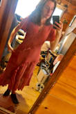 I got a small in the Rusty pink- I could have gone a size smaller for a better fit around my tiny waist. I was afraid of buying an XS for fear of not having room in the top. It might have been fine. Even then, I didn't really like the look of the dress once I put it on. It looks better in the second pic where I'm holding the sides in and pushing my leg out but otherwise for just normal standing around it felt frumpy. It would look better if it went to my knees - I'm pretty tall (5'7") so I imagine it would be even longer for my short friends. The backside kind of bothers me where the ruffles don't meet. And I wish the sleeves were spaghetti straps instead. The material and color are nice though! I would order again from Lulus as the shipping was not bad and the quality seems nice. Hopefully better luck next time! - Sierra P.