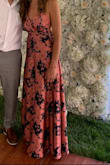 I wore this dress to an outdoor summer wedding. I got many compliments and felt so comfortable in this flowy dress. It is on the longer side. I wore flat strappy sandals instead of heels and did alright. I would pick the side of the dress up as I walked because there were a few times it got under my shoes. If you're any shorter than 5'9" you'd probably need to have it hemmed. As for the fit, the waist was great. The chest area is for a larger chest, but as a 34A my strapless bra did a fine job of filling it in enough. And about the bra, I was concerned I'd have to wear nipple covers or something because in the photos of this dress the back is pretty low. Because the straps are adjustable, I was able to raise the back of the dress, and then pull the back of my strapless bra down far enough to hide it. I kept it simple with no necklace. Color is different, and print is just so fresh. - Laura G.