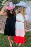 I got this for my bachelorette party and it was perfect. The waist did feel a little tight but I wouldn't have wanted to size up. The white part on the skirt is a bit sheer so I did have to wear a slip! Overall I would definitely recommend! - Jennifer G.