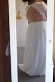I have a short body and therefore the dress was tight around the waist but large in the arms and any where the lace was on my back.  It is definitely a beautiful dress, I truly wish it was for me.  I'm glad I bought a backup, since the prices are excellent at this companyd - Jessica J.