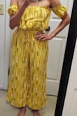 This is a lovely outfit all around. I ordered an XS; it fits in all the right places and I love how it's more of a loose, flowy style. The color is bright and happy and the material is great quality!! - Jessy C.