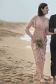 I love how this dress flows and how it transforms with the slit showing your leg or not, and the details of the sleeve. The material is great and the color is perfect with nude color heels. I wore it for my wedding photoshoot but would definitely wear it on other occasions! - Tiphany L.
