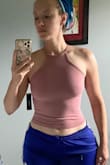 I wanted to love this but it doesn't fit me quite right. I could tell from the model pictures that this has a very fitted look, which is why I went with M/L size, but it's still tighter than I expected. I'm also unsure about the fit of the neckline on me, plus the bottom scrunches up a bit due to my wider waist towards my hips. I debated keeping this (I love the color and how it shows off my shoulders) but decided to return since I don't love how it fits me. - Amanda T.