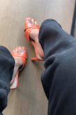 The orange color adds a lovely pop of color to any neutral outfit and is perfect for the summer. The heel height isn't too bad, and it pinches slightly in the front but not unbearable at all. I am a TTS 6.5 and the 6.5 fit perfectly! - Kaylee W.