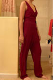 Don't do it, I went against the better judgment of the reviews by looking at the size and fit in the description. I had suuuch high hopes for this jumpsuit. For SMALL it says "Length: Ankle length. Size small measures 56.5" from shoulder to hem." So you'd think that the XS would be shorter, but it measures to 56.25 in from shoulder to hem. Waaay too big and long, it's a good 4 inches past my ankles. Can't return it because it's a final sale but don't buy unless you plan on spending money to get it hemmed. - Julie X.