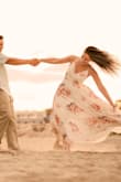 I am absolutely in love with this dress. It was perfect for my engagement shoot, a big long but it worked out perfectly with the wind and beach. - Kaitlin L.