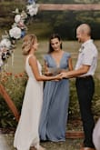 I wore this dress to officiant a friend's wedding, and it was so comfortable and flattering! I will say if you're on the shorter side, like me, I would go down a size. I had to significantly hem the bottom even with heels on. I also sewed the second slit in the chest, as it went down to my belly button. - Bailey K.