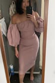 This dress is amazing! I ordered a small originally but it wasn't snug enough so I bought a size XS. This dress is hard to put on, my hips are too wide to be able to pull the dress up. I had to wear the dress like I would a shirt. I also need help zippering it from the back. Love the color! - Kathleen S.