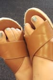 These slip sandals fit true to size, gave flexibility on the bands and are very comfortable. Love these shoes! - Candace B.