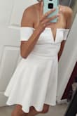 I had a beautiful white skater dress that I gave away because it was way too big on me and was looking for a new one. This one is absolutely perfect. I got the XS and it fits great! I love the ribbing in the bustline to help it keep it's shape! For smaller busted girls like moi, this is a huge help! Gorgeous outfit! - Jessy C.