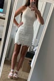 I was conflicted about buying a small or medium due to the reviews. I'm so glad I went with the small. The top and bottom fit perfectly. There is a little room in the middle section, but it isn't noticeable and I think it will actually be better for sitting down comfortably. I chose this dress for underneath my graduation gown and I've already received compliments. And if you're worried about wearing a tighter-fitting dress, don't be! The lace detail is very concealing and is fitted, not clingy. - Taylor H.