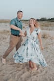 This dress is beautiful and looked amazing in my engagement photos. However, I could not give it five stars because it was extremely low cut and needed to be altered. I've read many reviews with the same issue. I'm very busty so it was still showy after being altered but better than what it looked like prior. - Caitlin I.