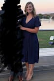 I felt that this was a very figure flattering dress. I was worried it's be too clingy around my stomach but it hid it well. Was also comfortable enough to dance the night away at a wedding reception. - Kelly L.