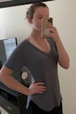 The model pictures made it look boxy, but it does have slightly tailored sides. I'd agree with everyone else to size down if you want this slightly fitted. I'm normally a small and the XS wasn't tight at all. I'm only worried if it shrinks a bit in the wash like half of my Lulus clothes do. Great quality material and super soft, but it's thin enough to show lacey bras or nipples through. I'd buy this shirt in every color, this is my new favorite staple piece. - Katie B.