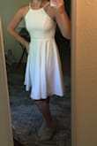 I love this dress. I initially ordered a small but had to exchange for an XS. I'm usually a small, so I might recommend ordering a size down. Both the first dress and the exchange were delivered super fast! I was so impressed with the quality of the dress. It fits perfectly and I love the adjustable straps. It is thick enough that it is not see-through, even in white. I can't wait to wear this for my rehearsal dinner in early September. It's a must have! - Sarah J.