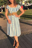 The dress is thick material and has many layers. Would say This is good for 70 degree weather. It can make your hips look bigger but I didn't mind it too much. - Natalia Z.
