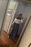 It has no stretch so do not size down! This size fit perfectly. It is so flowy and comfortable. Absolutely love! Long, but just enough not to drag with wedges on. - Clara V.