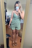 This romper looks exactly like the pictures shown on the website! Great length, not thin, & doesn't seem like it will ride up on you! This romper doesn't really add shape to your waist, but it's cute regardless. - Casie T.