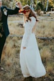 I didn't want to spend hundreds on a dress, but still wanted to look fabulous. The next closest dress to this style cost 700$.
I needed a little bit of a hem, and the bust was just a little loose, and sleeves a little long and loose.
It came in a timely manner and in great condition. Perfect for our simple, outdoorsy wedding in October. - Elizabeth H.
