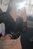 This is cute and comfy has some stretch but is mostly fitted. My favorite lace top! - Haley H.