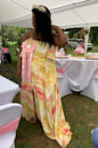This is such a pretty dress. I felt very pretty at my baby shower. I read the other reviews that stated the dress ran a little large. Since I am currently 8 months pregnant the large fit perfectly! I will say if you are short the dress is very long so it will need to be hemmed. - Deja D.