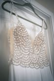 This dress is amazing! As many other people I had to have a very small wedding in my backyard and the dress truly made me feel like a princess. I contacted the fit expert and she was wonderful. I was unsure about my size, I was between size 2 and 4, so the expert asked if I wanted the dress to be fitted or more relaxed and she suggested Size 4 because I said I wanted to feel comfortable in it. I thought it was going to be too big, but and I am glad I listened to her because it was perfect for me. I had to get it hemmed and I had to sew one of the two hooks that goes in the lower back because it came completely off. It is a good quality dress but it is a little see through. Overall, I am very pleased with my purchase!!! - Monica V.