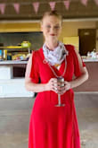 I am wearing red for my wedding so needed a red dress for my shower and with shops closed I decided to go online. The dress was a little large but I soaked in water, towel roll dried it, and then left it to hang. It ended up fitting perfectly. Was a 90-degree day and was still comfortable (as much as you can in that heat). Highly recommend! - Courtney K.