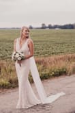 I originally had a 250 person wedding planned for July. Unfortunately, due to COVID-19 restrictions I would only be allowed to have around 50. My husband and I chose to go ahead and get married in a small country Church with just our immediate families. This dress worked perfect!!! Was so flattering and needed no alterations. Very easy to move in. Material is super durable and held up like an expensive dress. The lace is gorgeous and photographed beautifully! - Becky S.