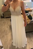 I ordered this dress in two sizes, 8 and 10, for my elopement and the 8 was perfect! It was so beautiful, I especially loved the back. However it was a little uncomfortable on my underarms due to the beading, and I couldn't imagine wearing it for an extended amount of time, so unfortunately it wasn't the one for me! - Diana W.