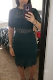 I bought the forest green dress for an upcoming September wedding.  There is not much stretch to the dress and it is very form fitting.  I'm usually not a fan or dresses that show all my curves but the style is beautiful!  The lace is the perfect touch!  Although it is form fitting I wouldn't size up as the sleeves would be too baggy.  I'm thinking of pairing it with a nude shoe.  I can't wait to wear it! - Kristin S.