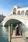 I took this dress to wear on a trip to Venice and it was just fabulous. I love the fit because it feels modest & spicy at the same time. The high modest neckline contrasts the spicy yet appropriate slit in the skirt (not too high). The flow of the skirt makes you want to dance! Great, thick fabric & the design is so forgiving. I feel incredibly powerful wearing this dress. Highly recommend for the Plus Size-ish ladies! - Ainslee W.