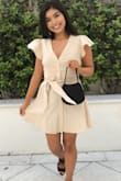 I saw the dress on the website and fell in love right away. The color is perfect and fits true to size. The bow and ruffles give it a cute feminine touch. It's the perfect summer dress! - Karla S.
