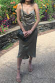I got the dress in green and it's gorgeous! It's has a satiny texture and thin, but not see-through thin. My one problem was that there were no extra smalls when I purchased it so I ended up with the small. The small was too big but with some alterations I was able to wear the dress. Definitely size down! - Hannah P.