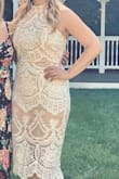 I wore this to my bridal shower and got so many compliments! I felt confident in it all day and absolutely loved it! 

It doesn't stretch at all so if you're in between size I'd suggest going up! 

I plan on buying this dress in every color as they become available! - Paige L.