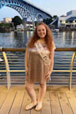 Perfect dress! I wore it for my bachelorette party and felt so sparkly without feeling too over the top. The color is more of a champagne gold color. Perfect length. Good for a large bust area to not feel so smooshed. - Rachel S.