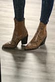 I saw these as a final sale and HAD to get them. They're slightly big in my regular size but still perfectly fine to wear. They come higher than the normal short cut booties. So stylish, I absolutely can't wait to wear these!!! They look expensive too. - Lauren H.